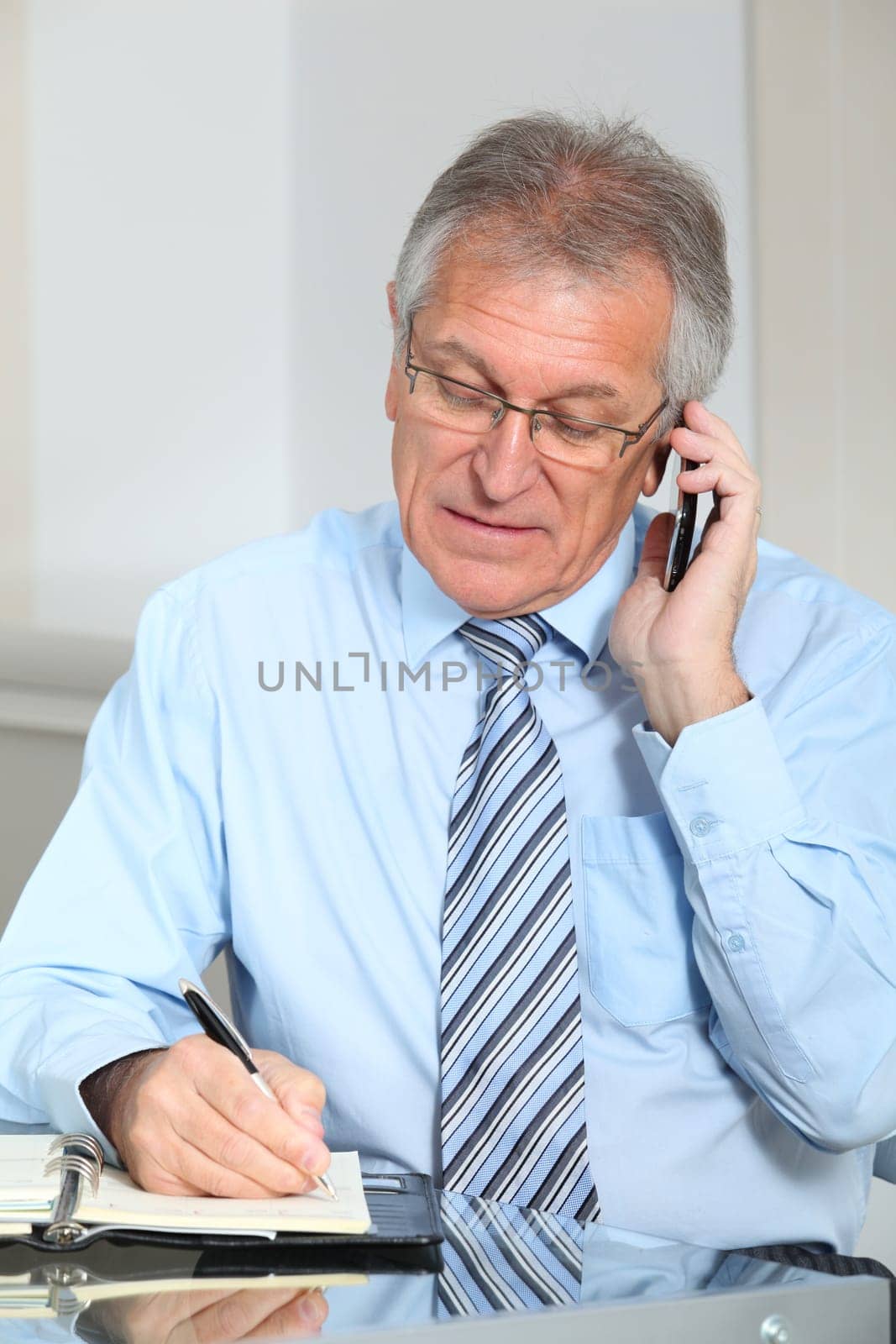 Portrait of senior businessman in office