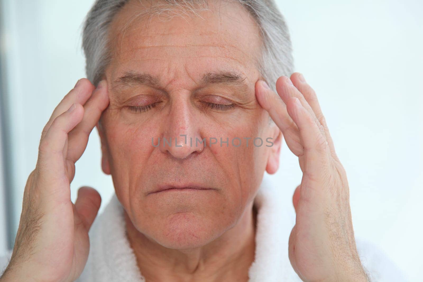 Senior man having a headache