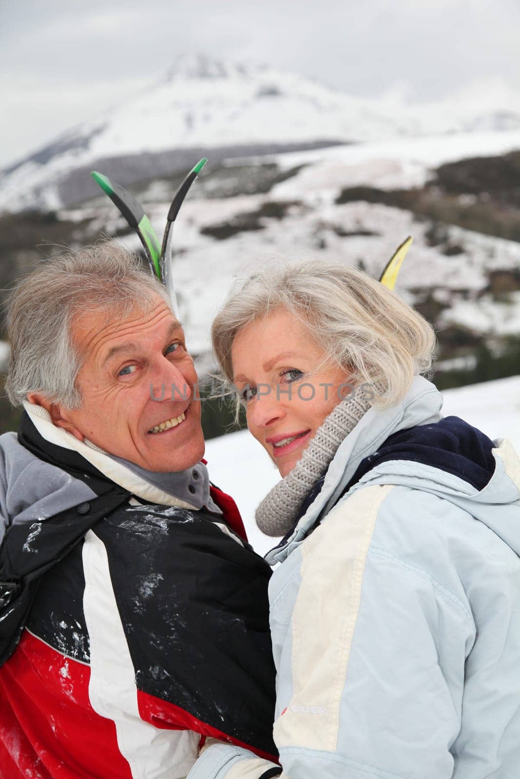 Portrait of senior couple in ski resort