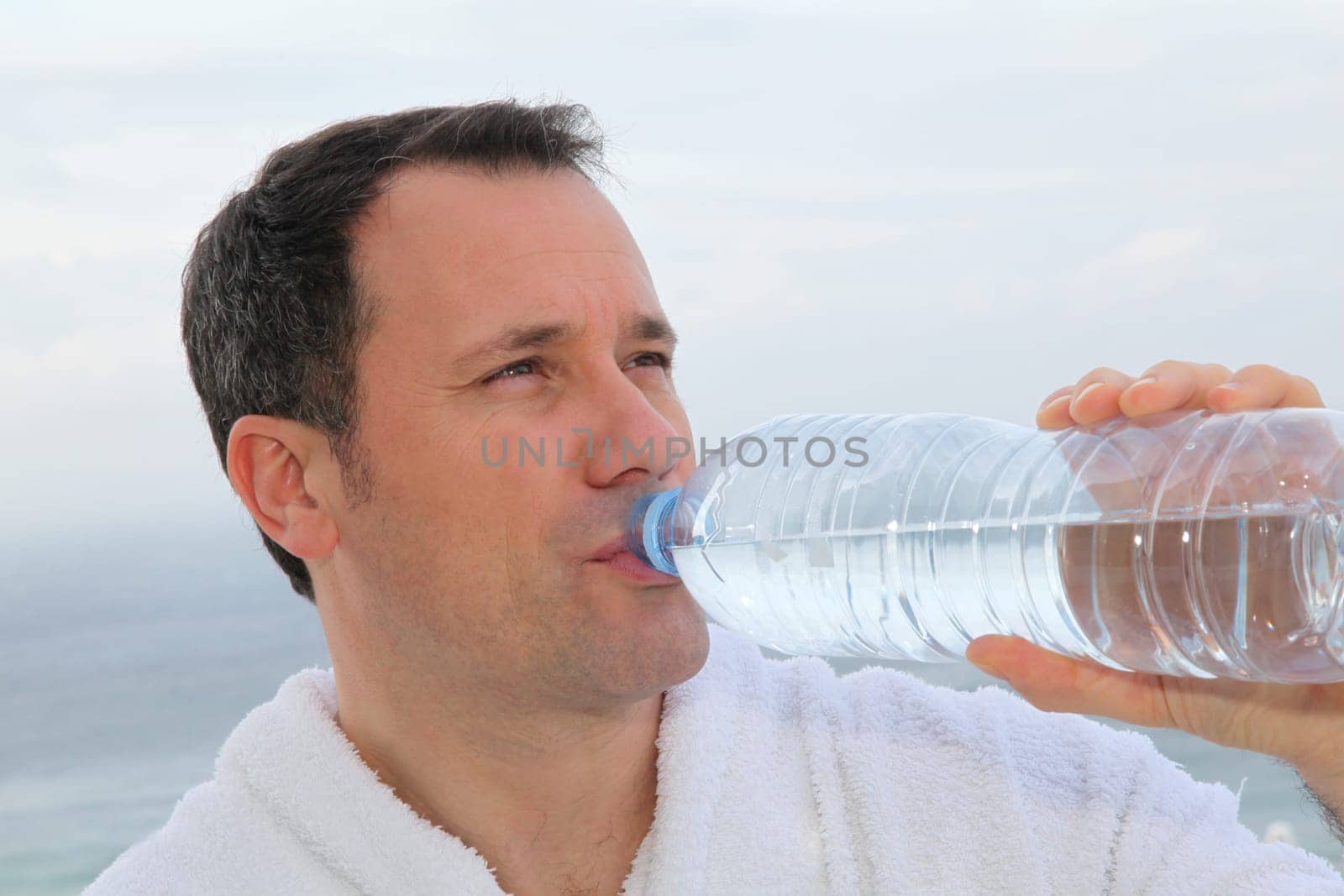 Man drinking water from bottle