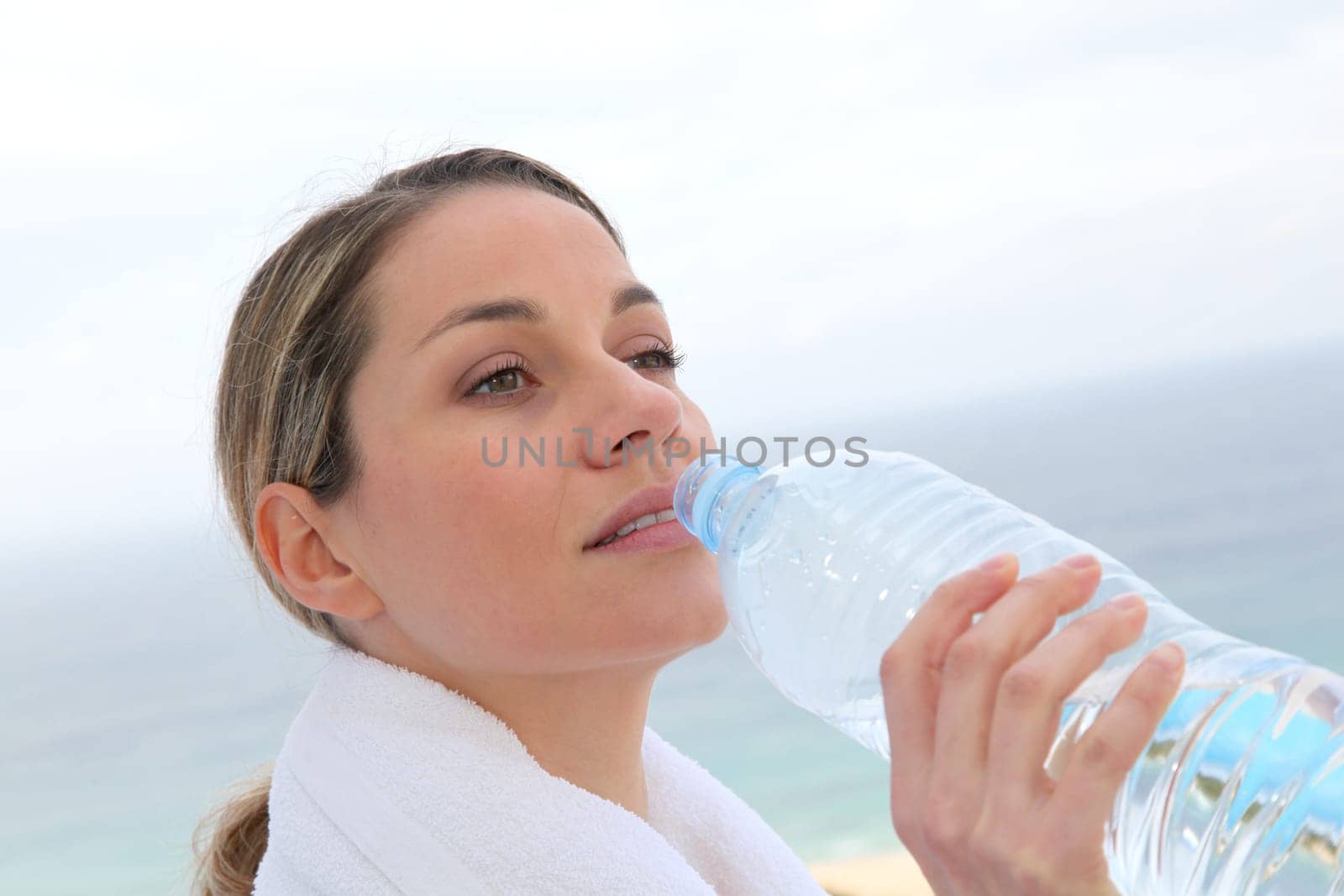 Woman drinking water from bottle