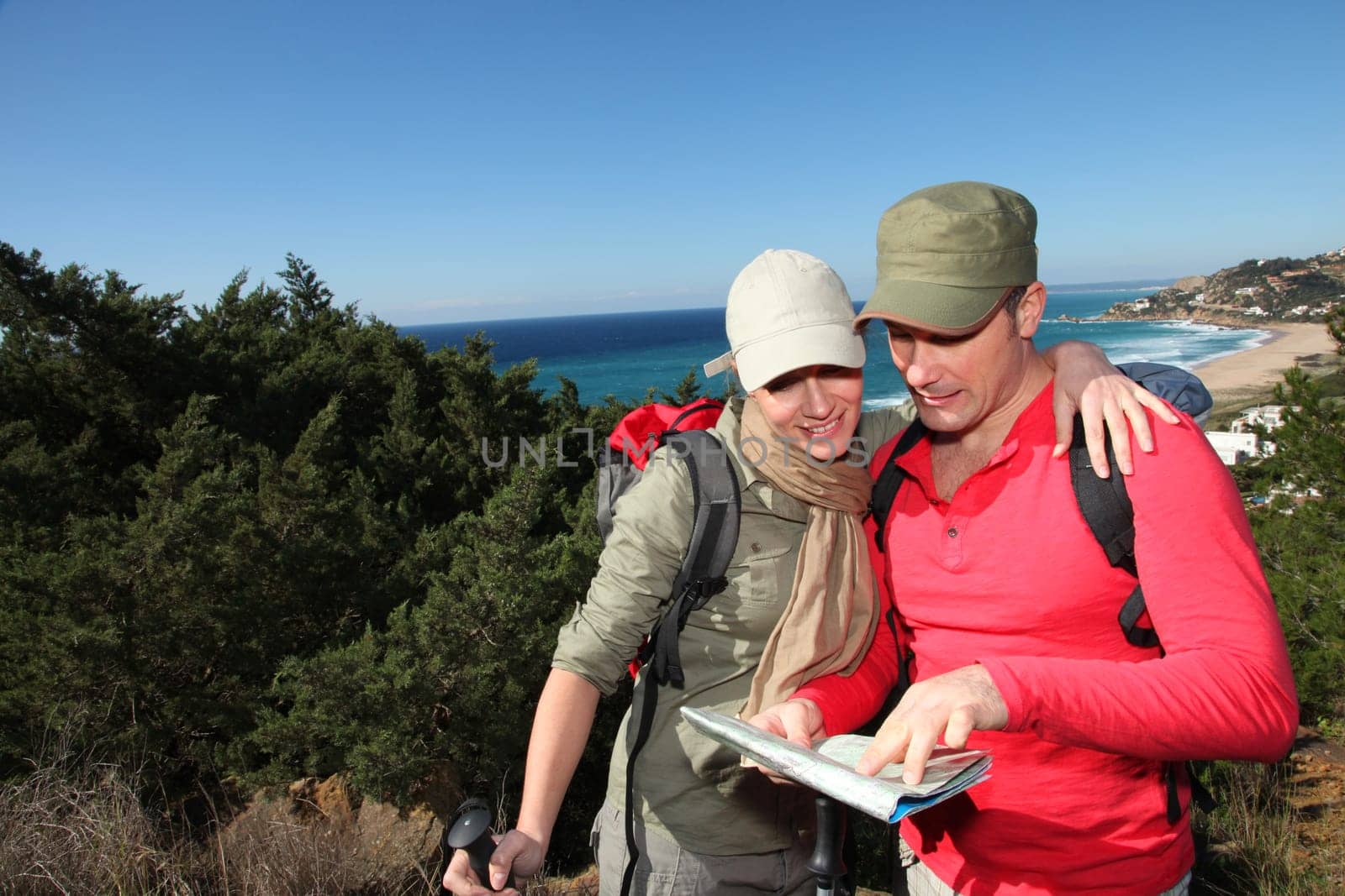 Couple looking at map on a hiking day