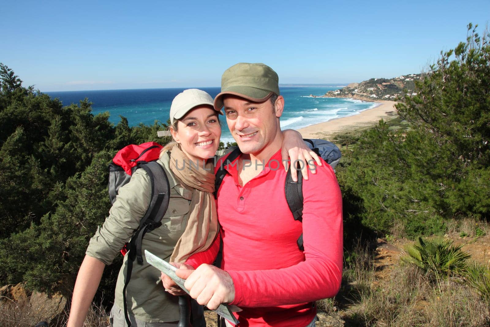 Couple looking at map on a hiking day
