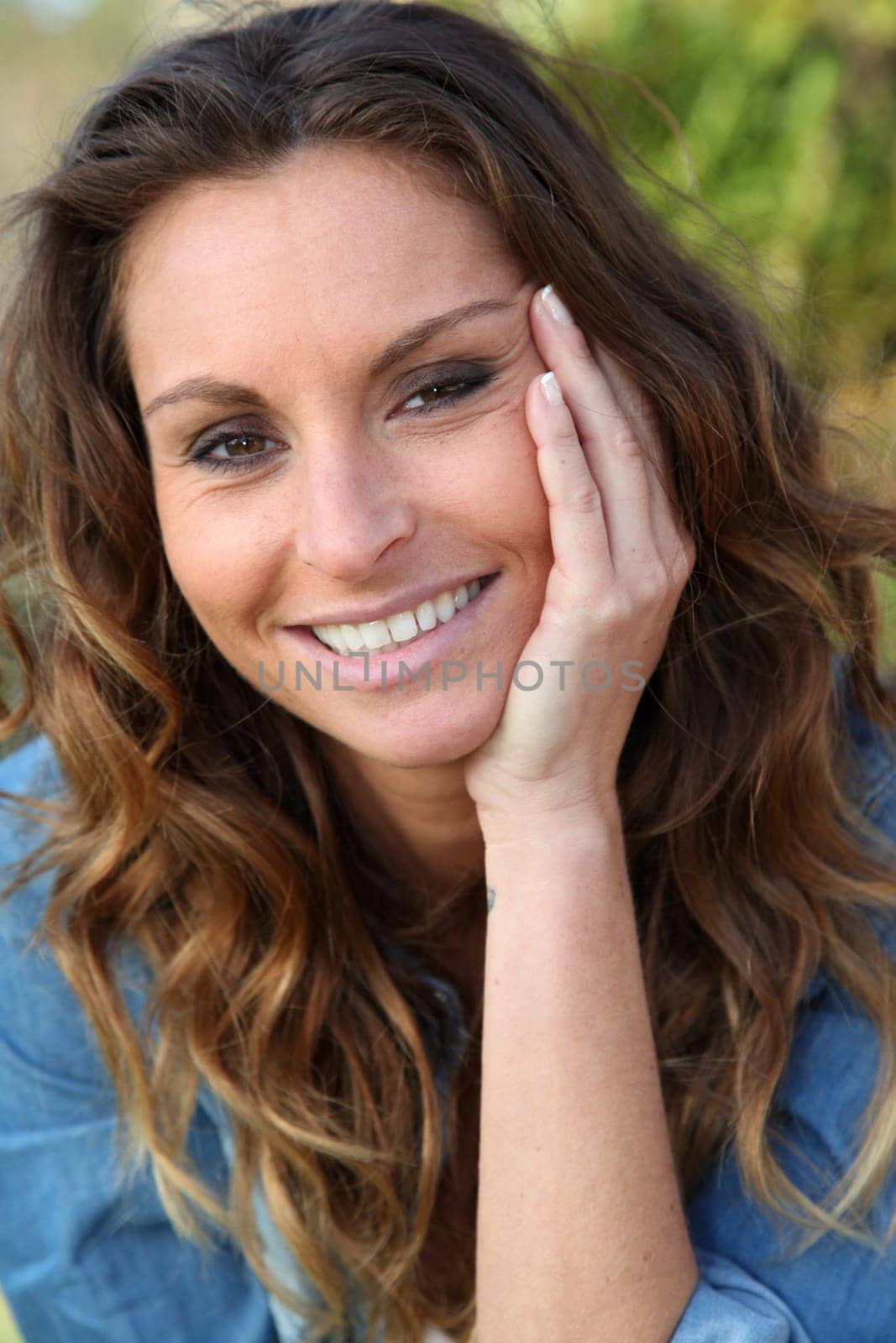 Portrait of beautiful woman relaxing in home garden