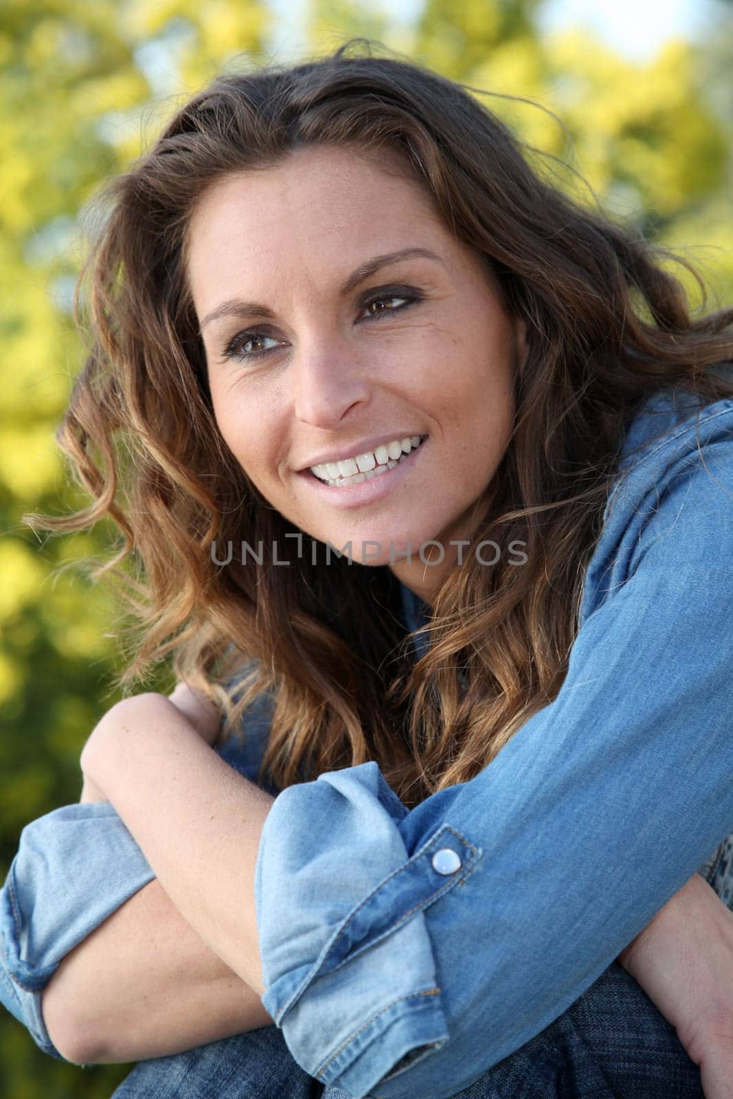 Portrait of beautiful woman relaxing in home garden