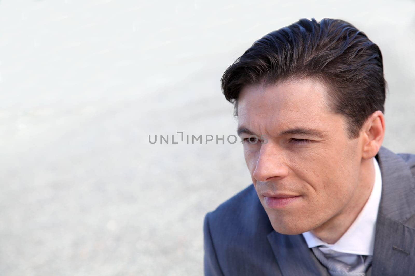 Portrait of businessman standing outside the office