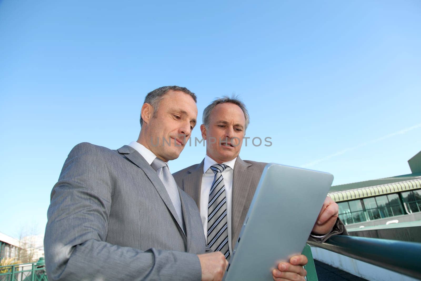 Businessmen meeting outside the office