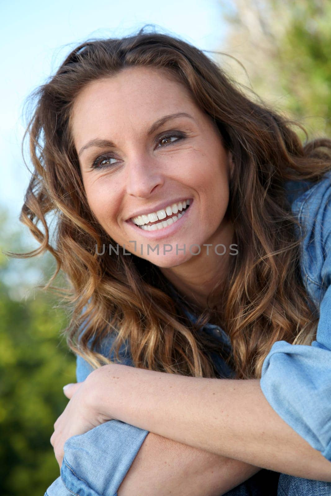 Portrait of beautiful woman relaxing in home garden