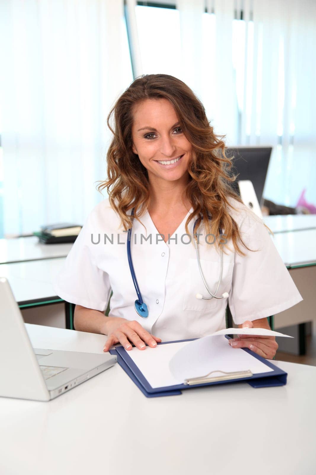 Portrait of beautiful smiling nurse at work