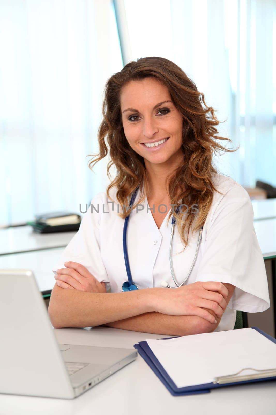 Portrait of beautiful smiling nurse at work