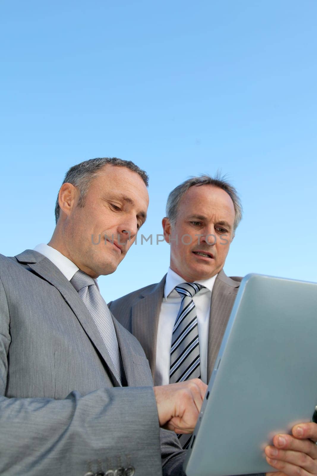 Businessmen meeting outside the office