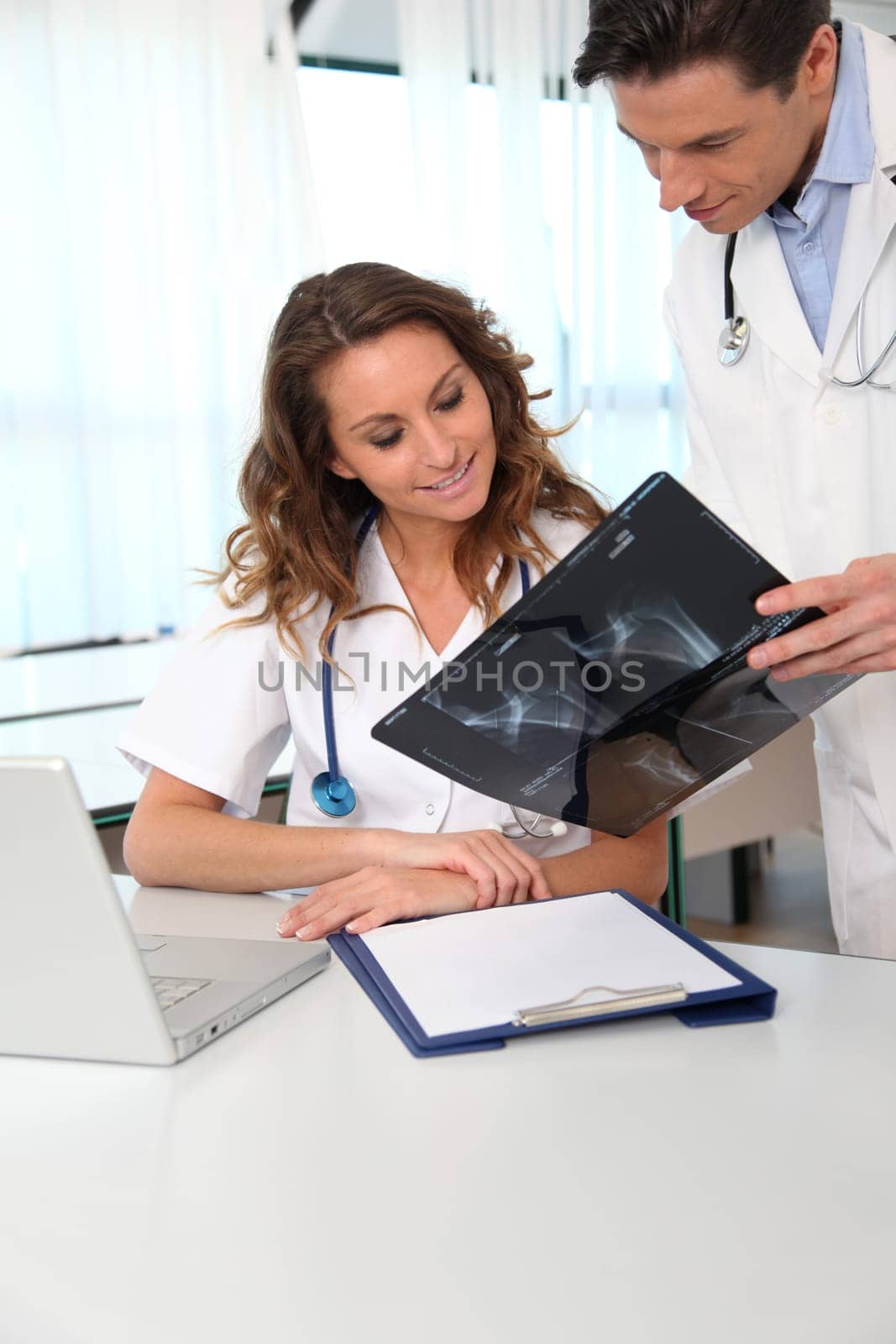 Doctor and nurse looking at xray results