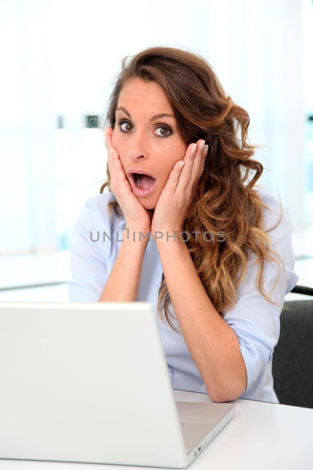 Portrait of office worker with surpised look