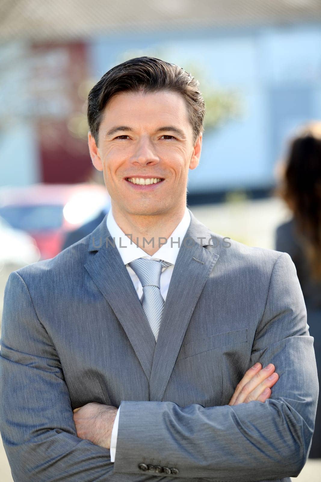 Portrait of businessman standing outside the office