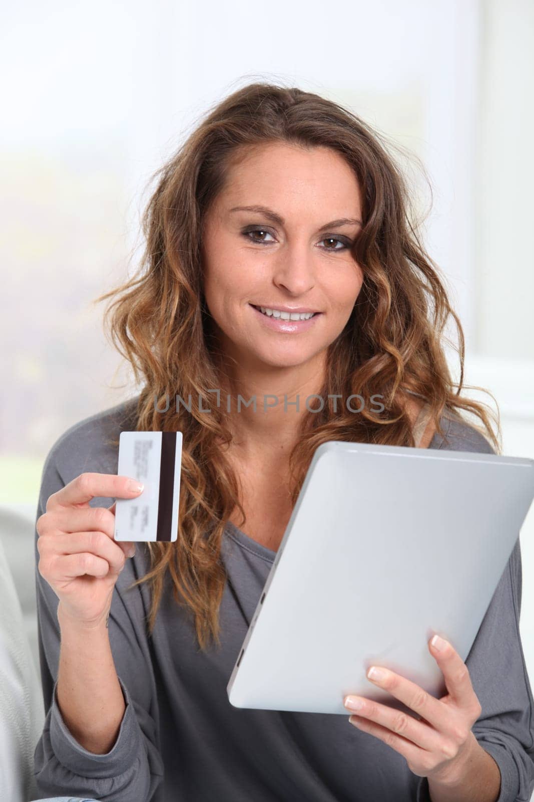 Woman doing online shopping at home