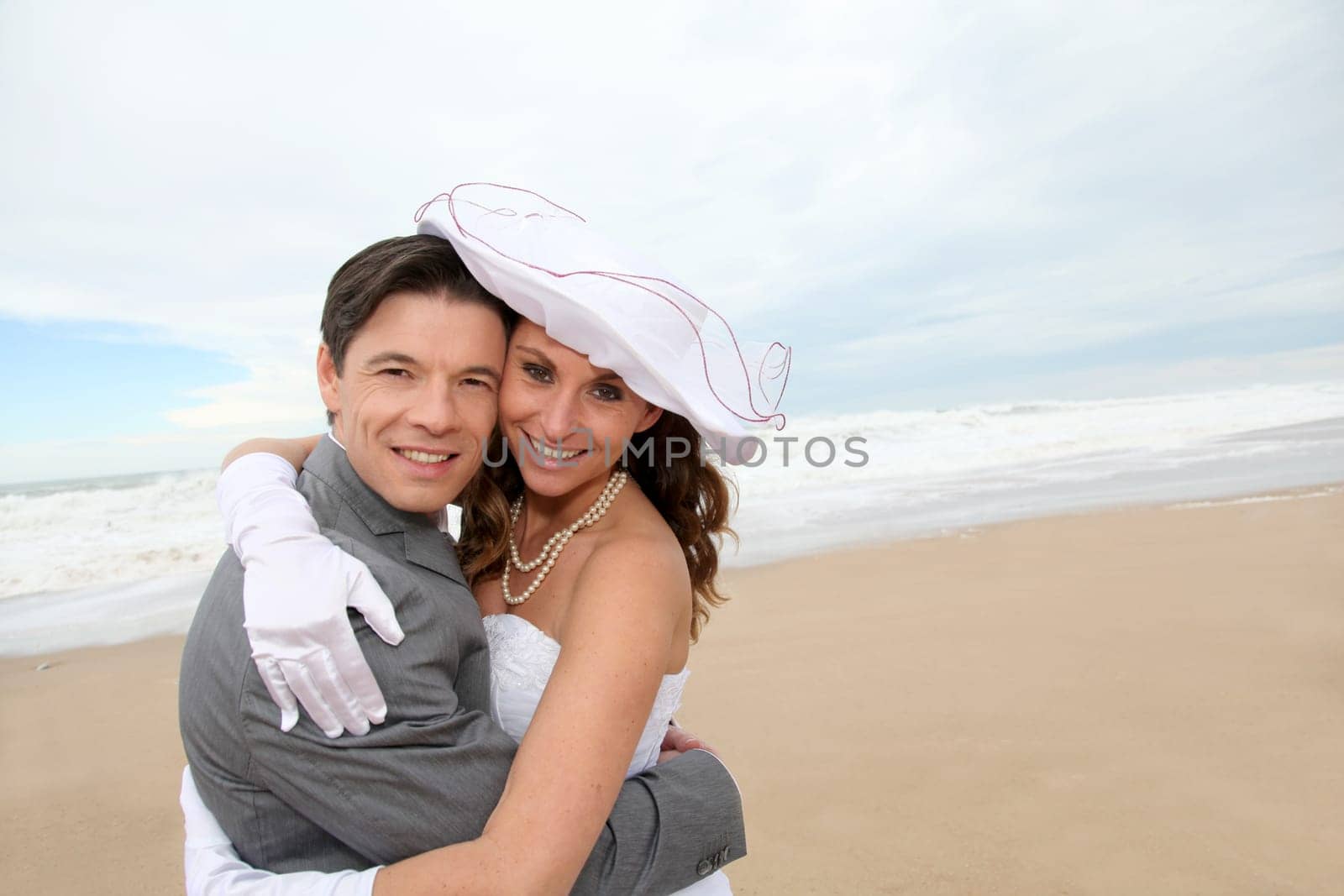 Portrait of happy married couple at the beach