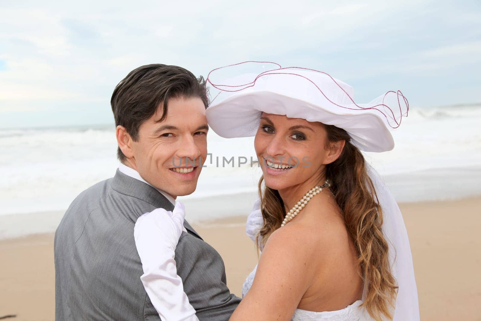 Portrait of happy married couple at the beach