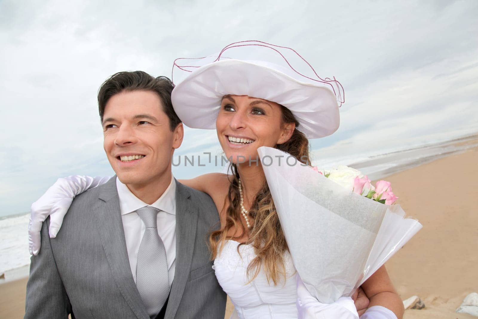 Portrait of happy married couple at the beach