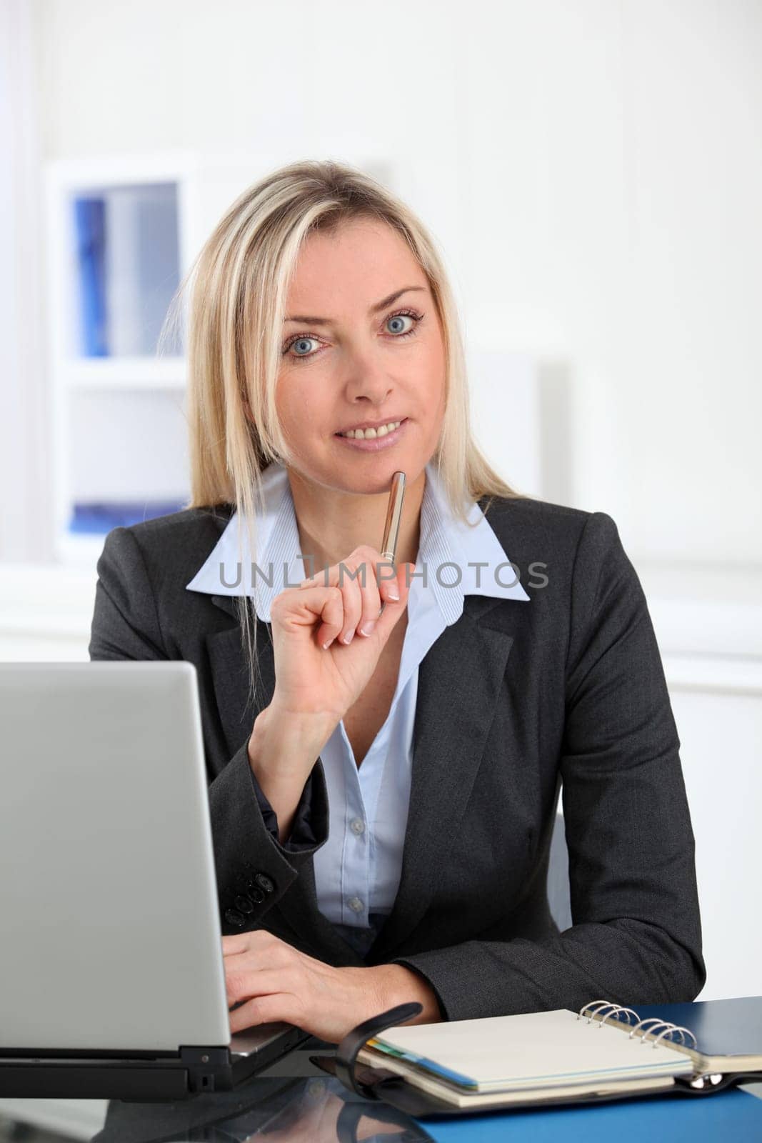 Businesswoman in the office with laptop computer