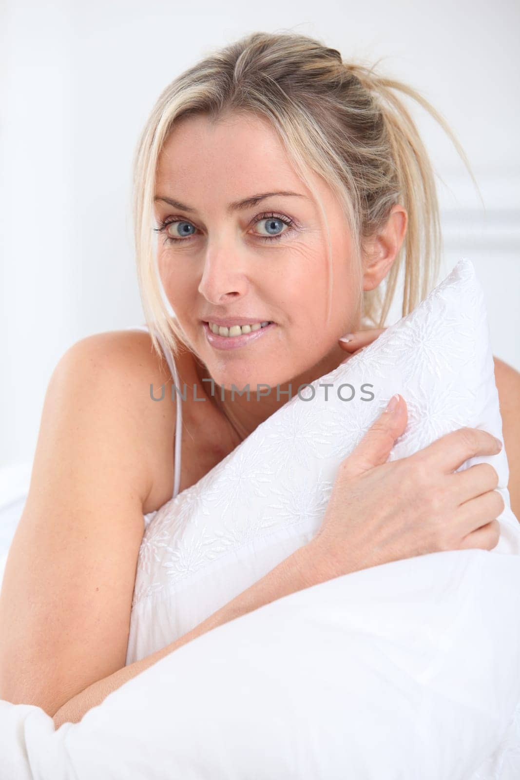Portrait of beautiful blond woman in the morning
