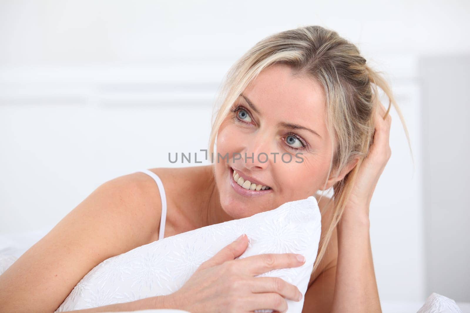 Portrait of beautiful blond woman in the morning