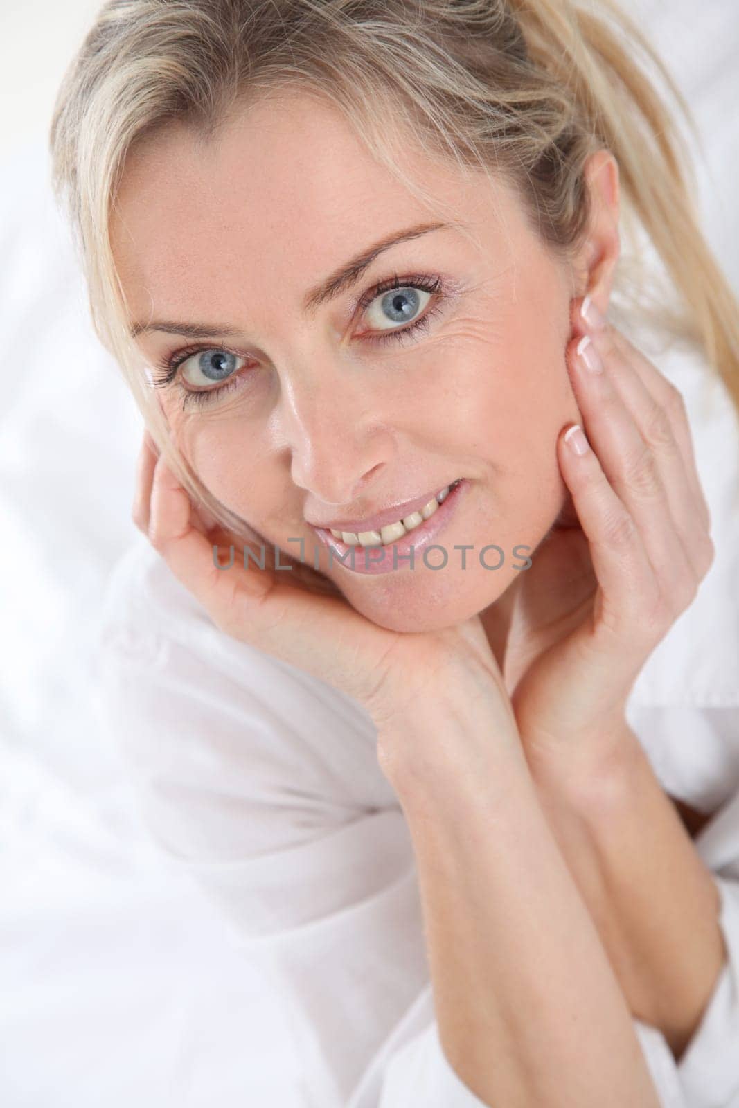 Portrait of beautiful blond woman in the morning