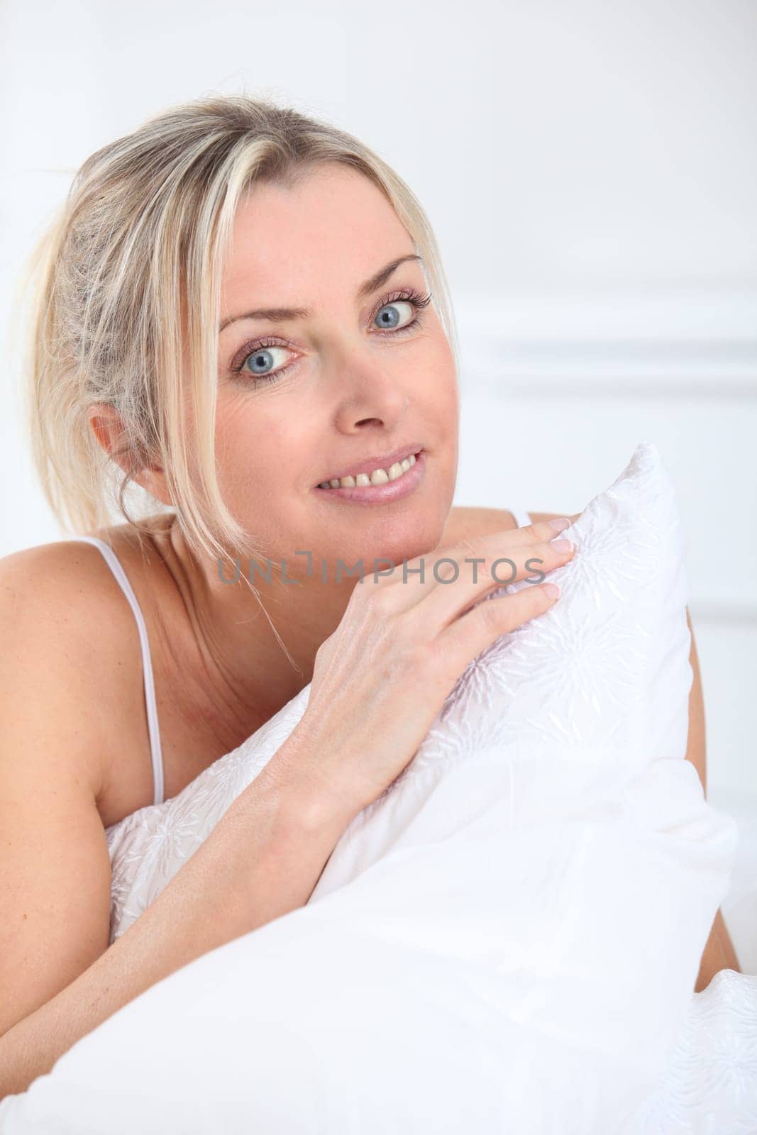 Portrait of beautiful blond woman in the morning