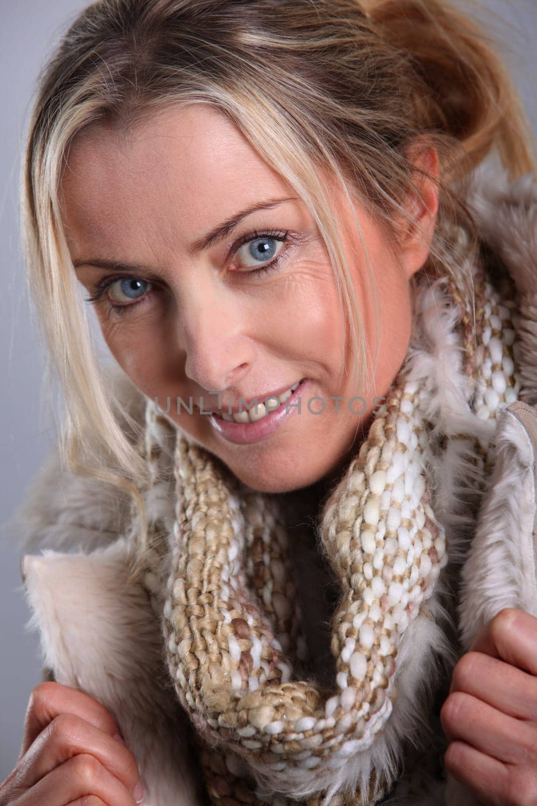 Portrait of blond woman wearing winter jacket