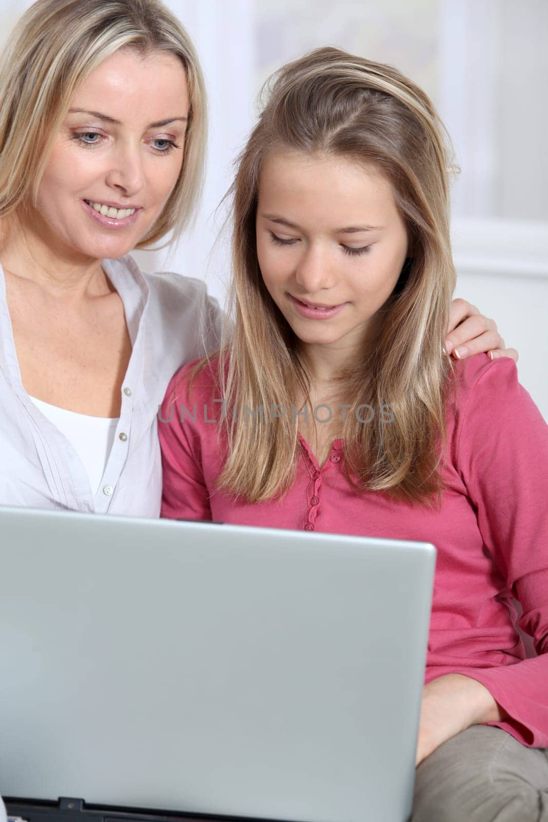 Mother and daughter websurfing on internet