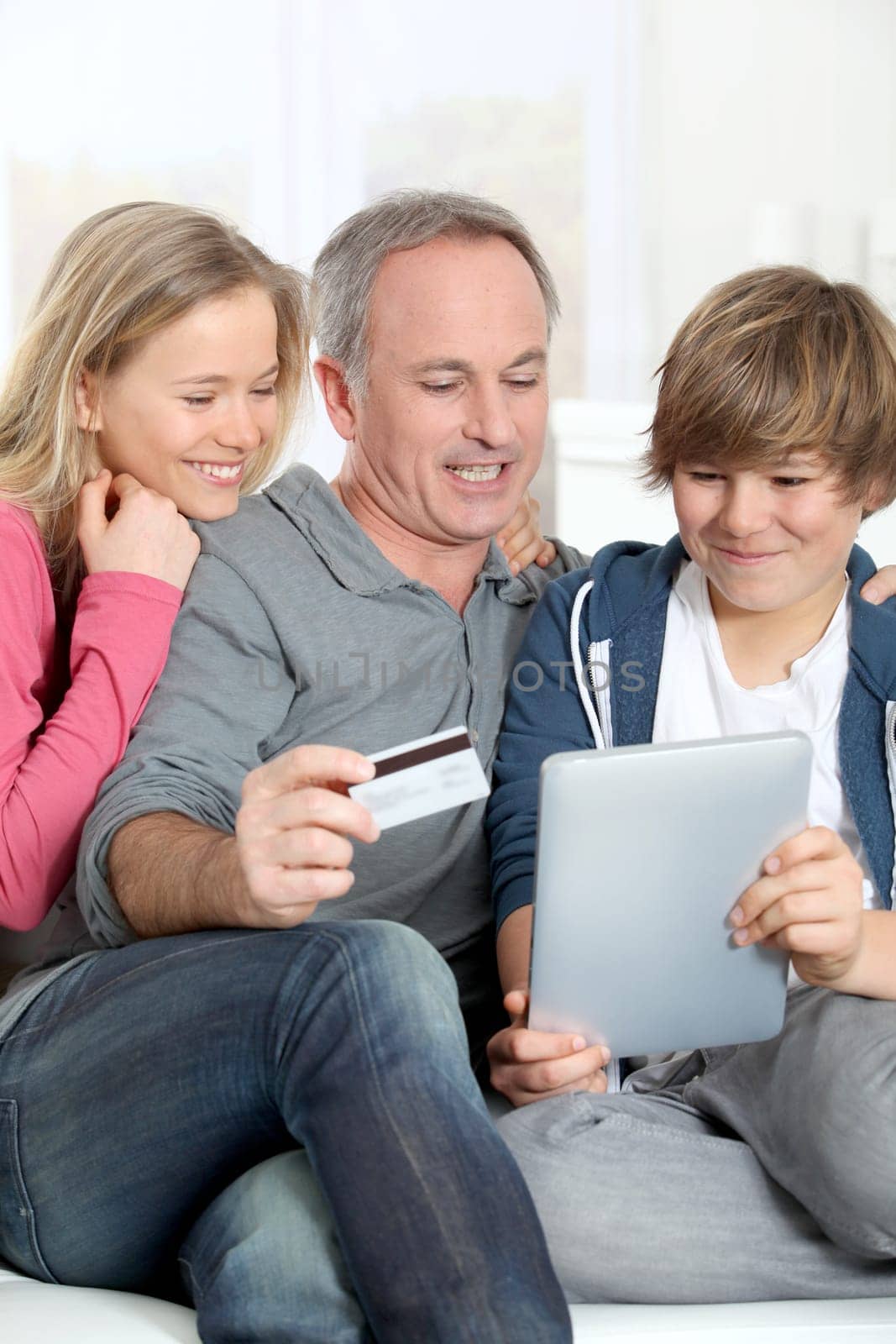 Father and children doing online shopping at home