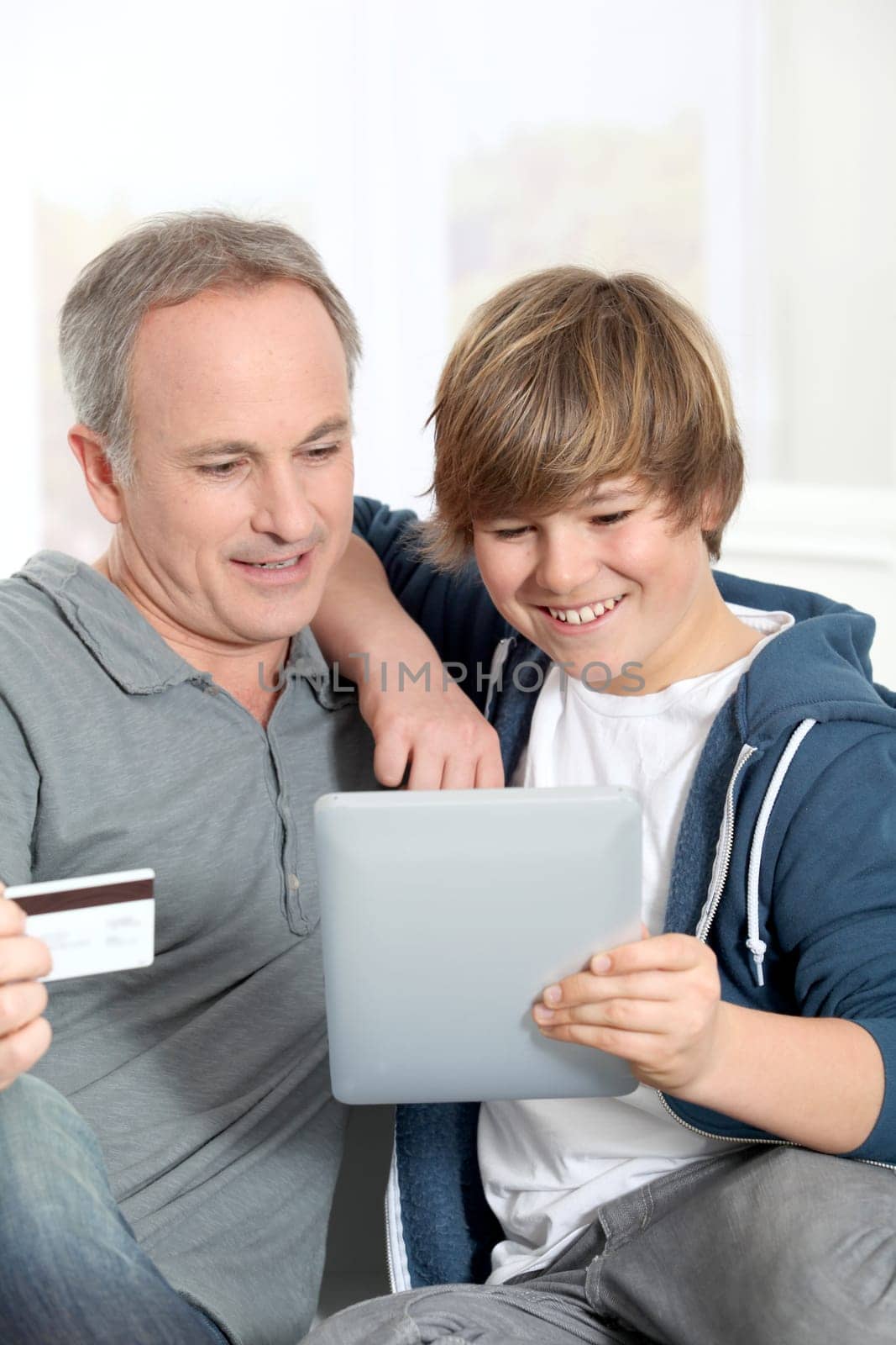Father and son doing online shopping