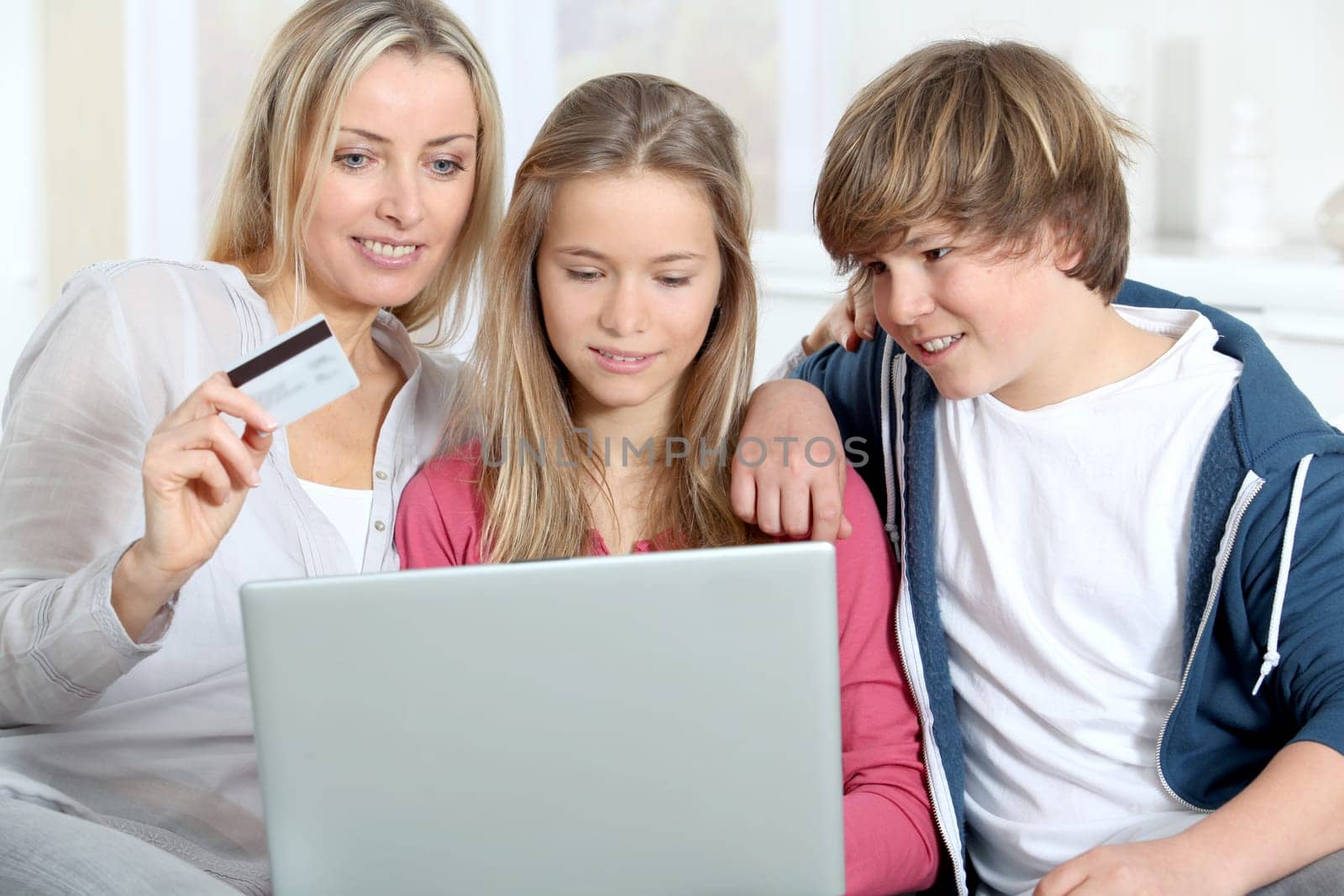 Mother and children at home doing online shopping