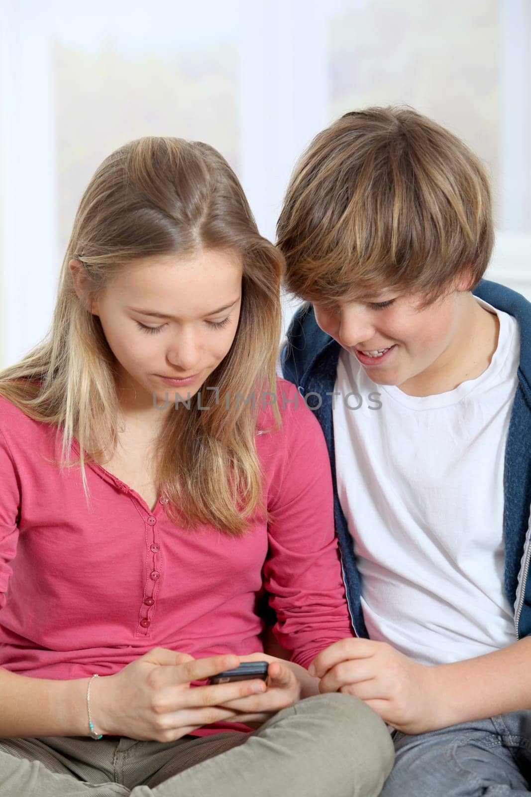 Young teenagers using mobile phone