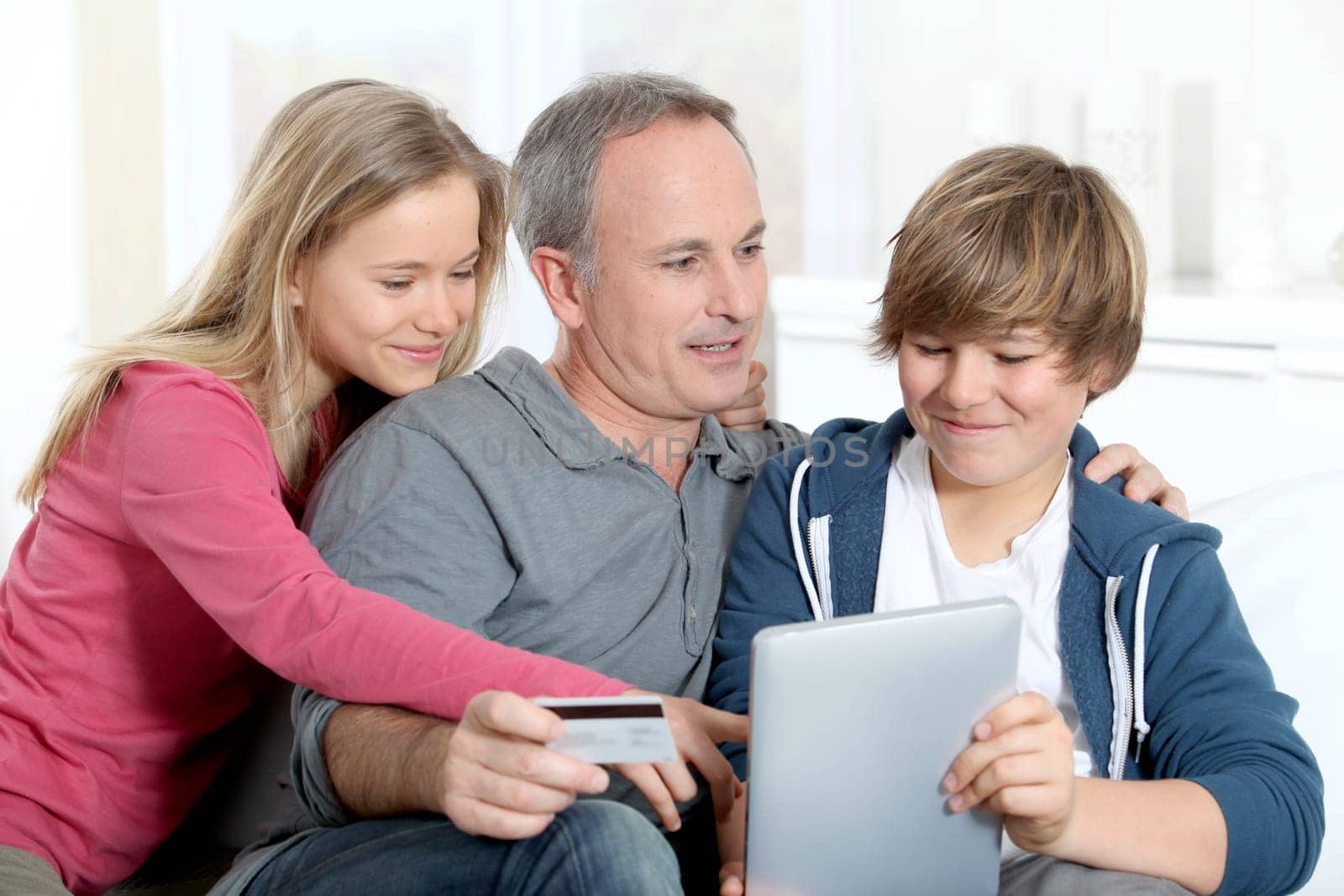 Father and children doing online shopping at home