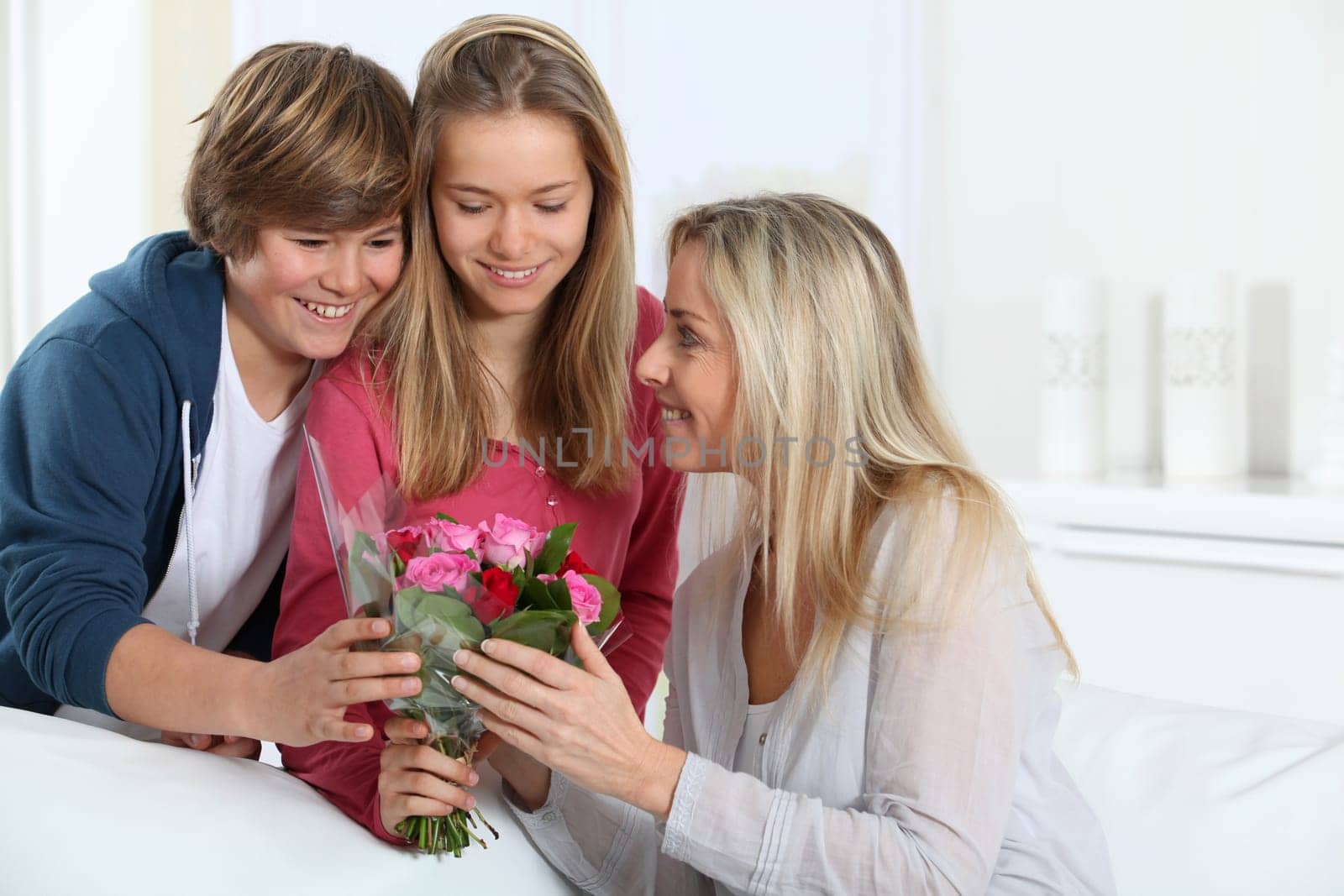 Children offering bunch of flowers on mother's day