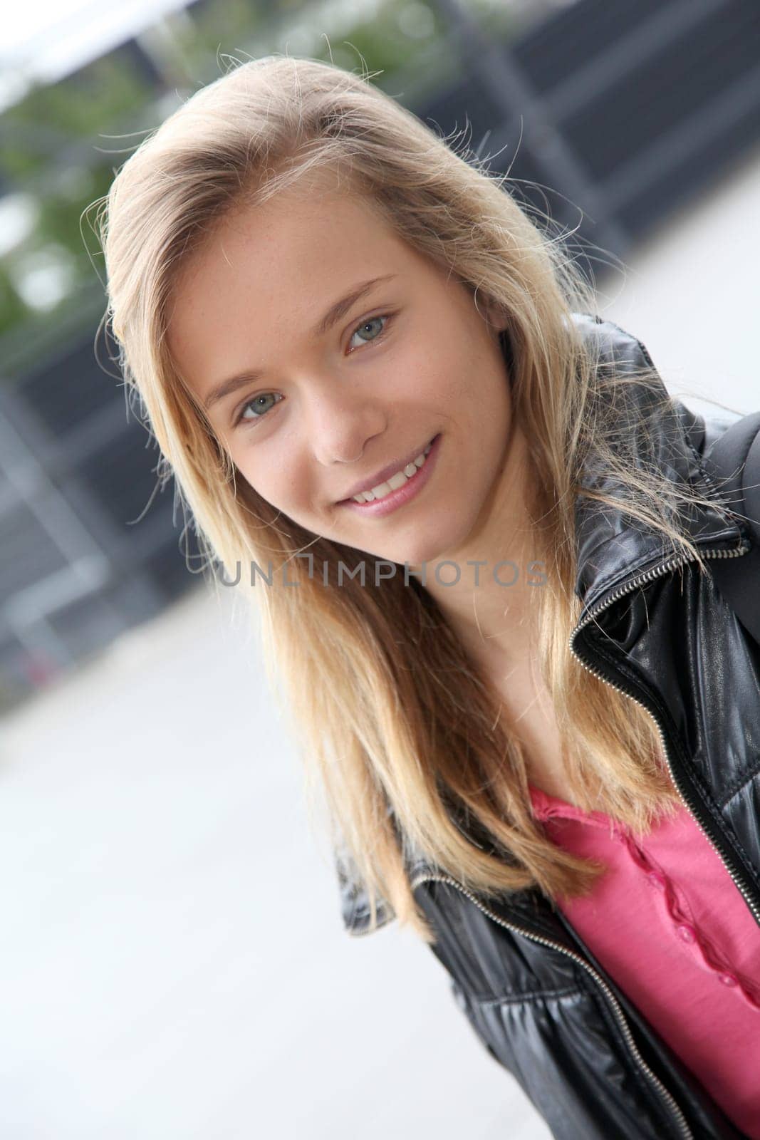 Closeup of teenage girl sitting on a school bench