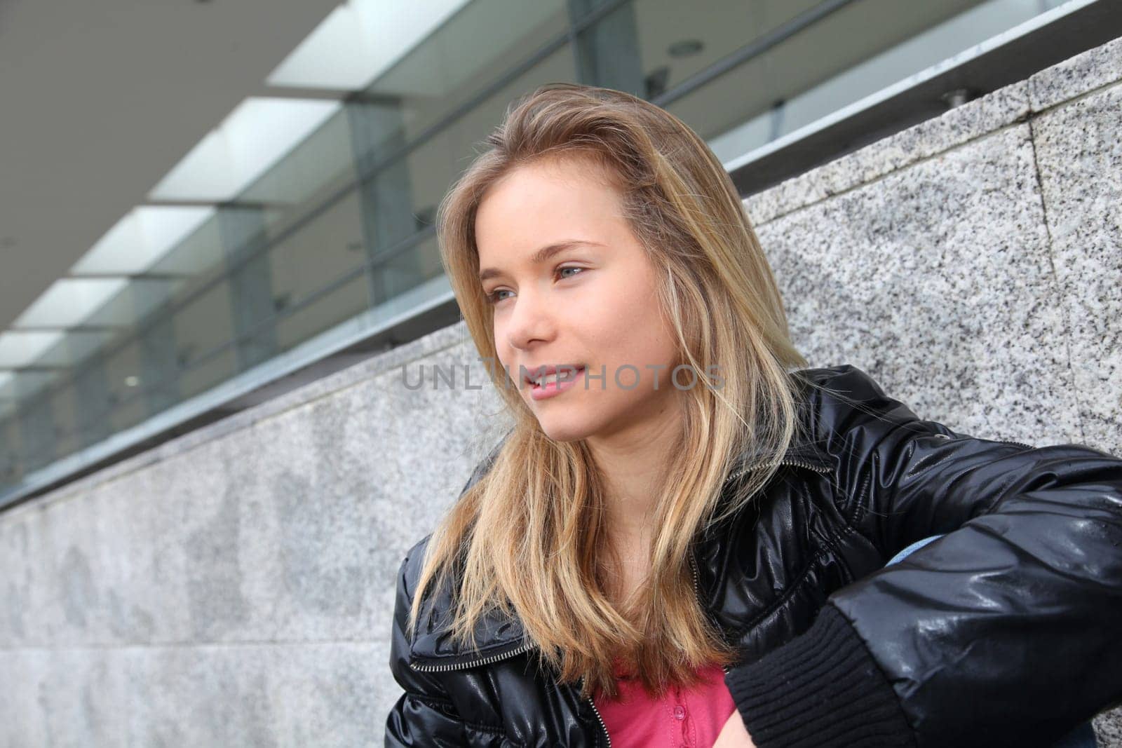 Closeup of teenage girl sitting on a school bench