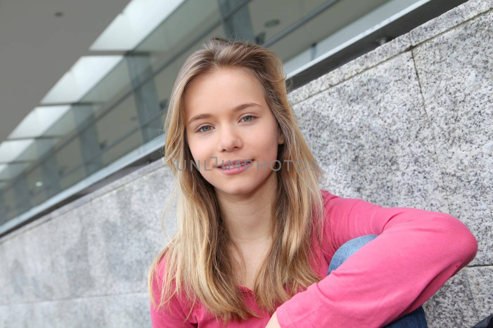 Closeup of teenage girl sitting on a school bench