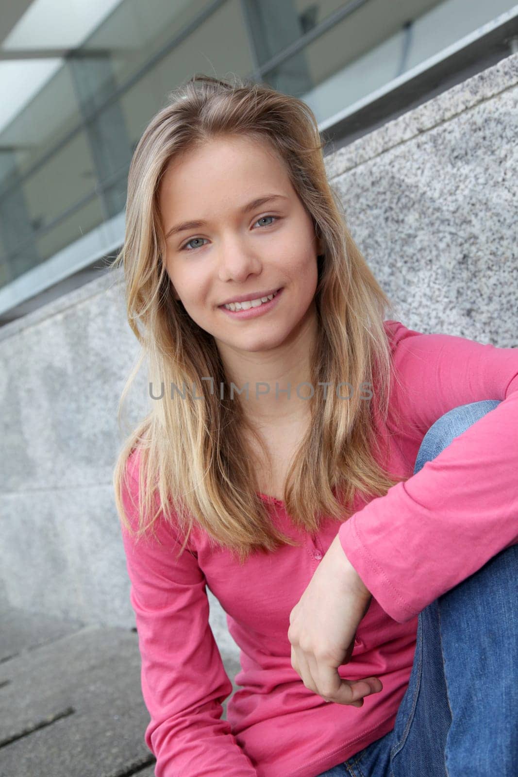 Closeup of teenage girl sitting on a school bench