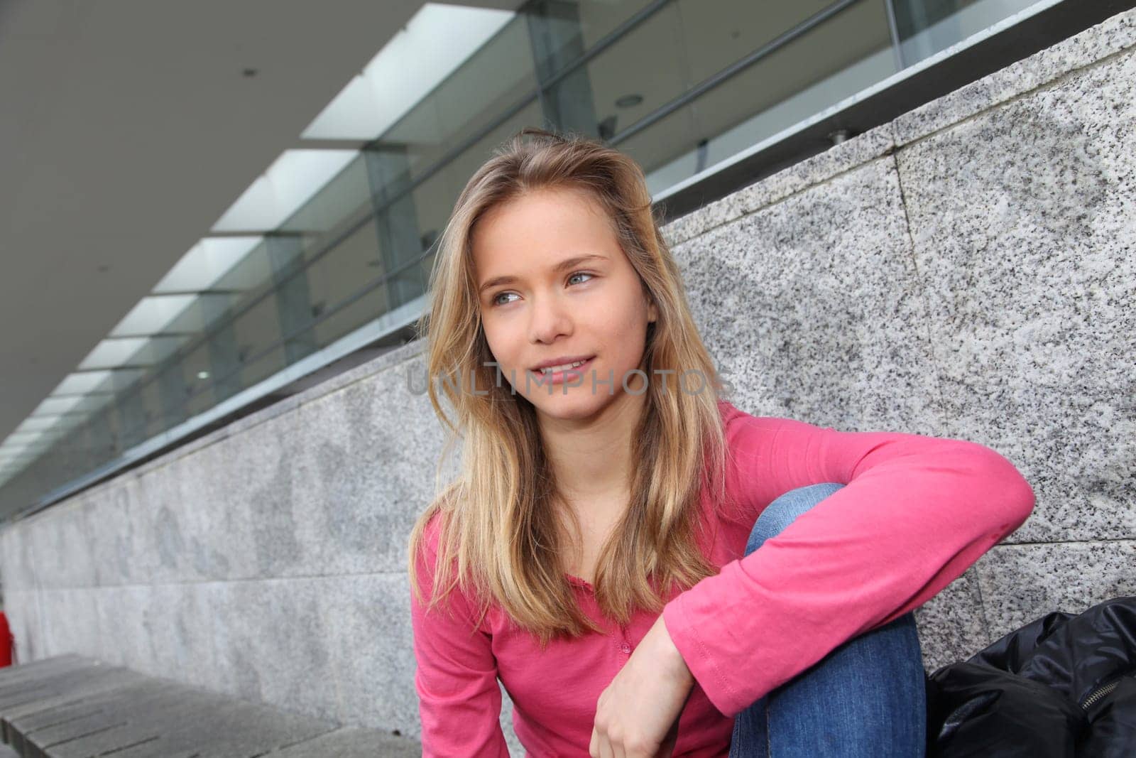Closeup of teenage girl sitting on a school bench