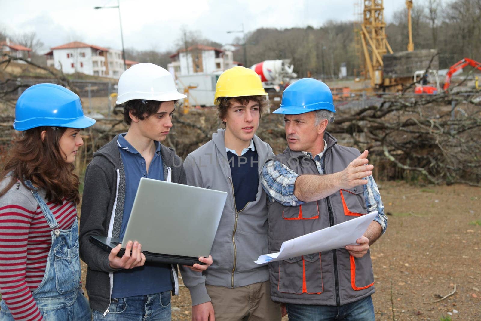 Adult with group of teenagers in professional training