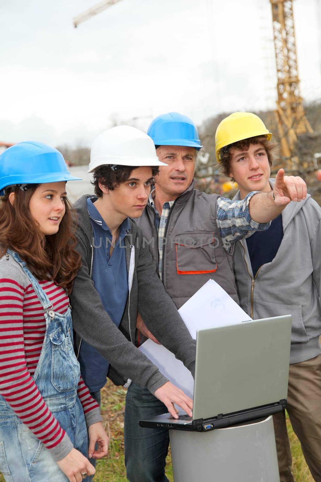 Adult with group of teenagers in professional training