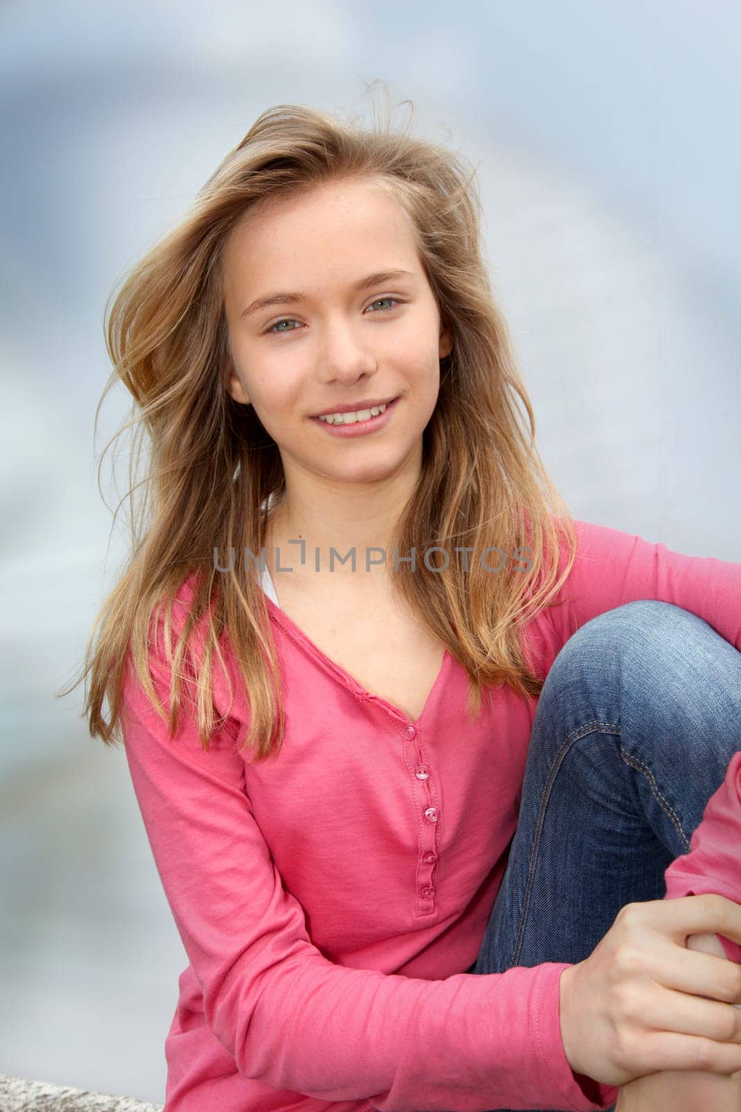 Closeup of teenage girl sitting on a school bench