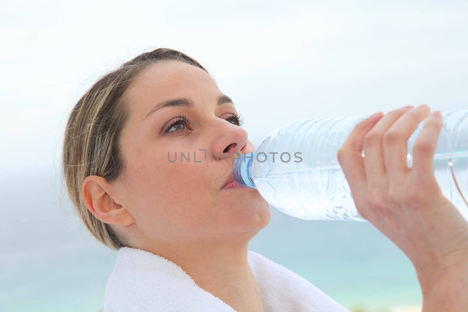 Woman drinking water from bottle