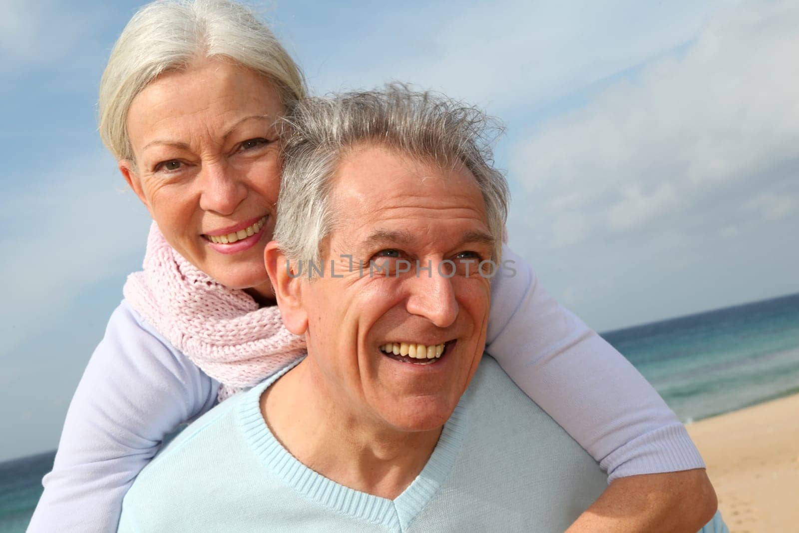Happy senior couple at the beach