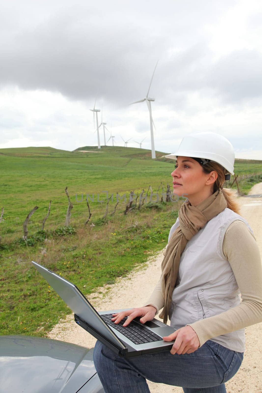 Engineer in wind turbines field using electronic tablet