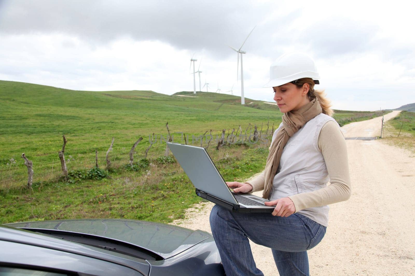 Engineer in wind turbines field using electronic tablet