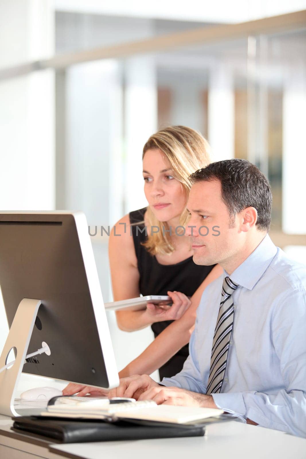 Office workers in front of computer