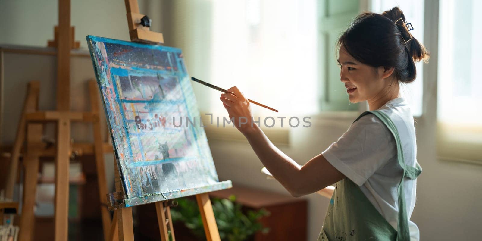 hand of artist with brush painting picture art, creativity, artistic and artwork, painting concept.