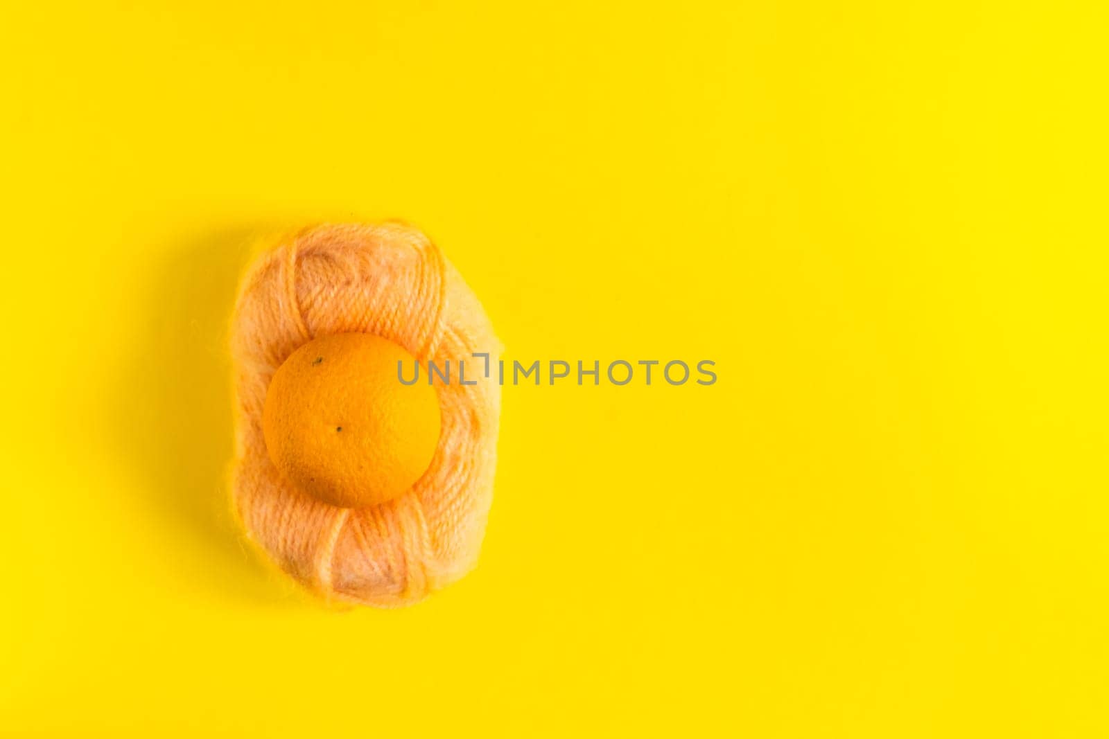 Oranges and tangerines on a yellow background. Fresh healthy food. Chinese New Year